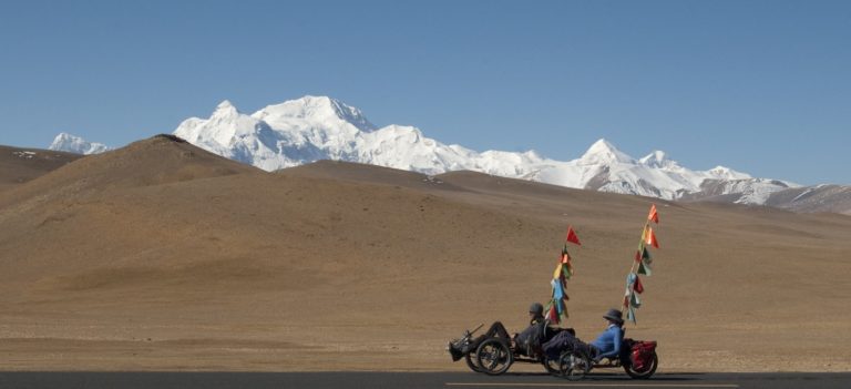 Paul Pritchard and his wife in Tibet on trikes