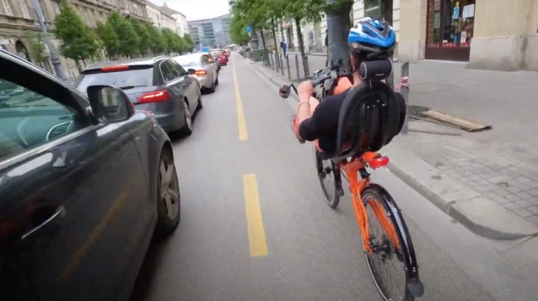 Viktor Zichó riding on a recumbent bike in Vienna and Budapest