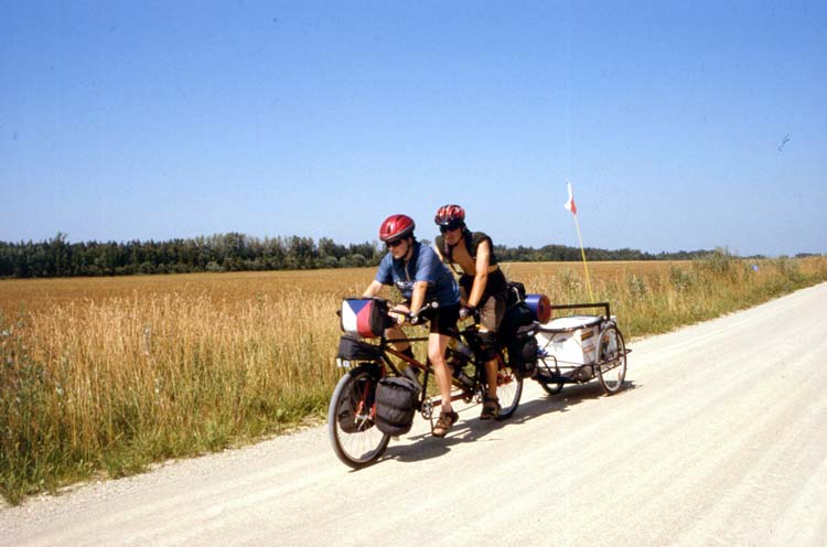 Eva Navratilova and Honza Galla cycling on a tandem bike through Baltic states