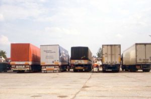 upright tandem standing among trucks in Poland