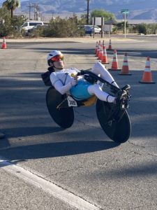 Racing thru the pit on a Cruzbike road recumbent bike