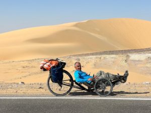 Mohamed cycling on his trike in Egypt