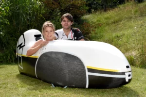 Nici Walde and Daniel Fenn with the miniDF record winning velomobile