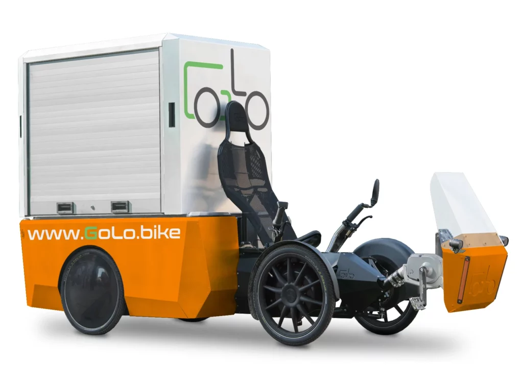 GoLo cargo bike with recumbent seat, four wheels and a pedal generator for serial hybrid transmission