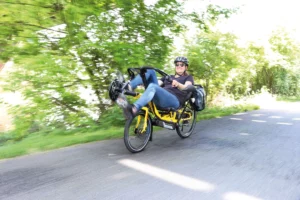 Riding the recumbent bicycle outside of the city