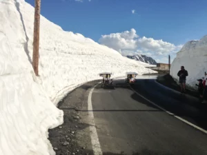 Crossing Petit St. Bernard Pass between France and Italy with extra high snow drifts