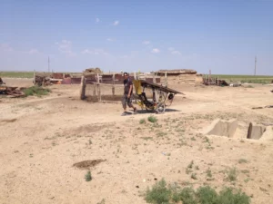 I drag the damaged tricycle several kilometres to a nearby village