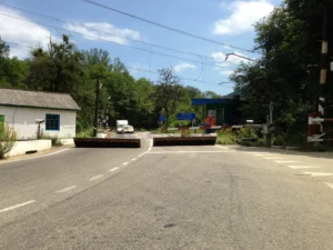 If the barriers at the railway crossing aren't enough, the whole road has to be raised...