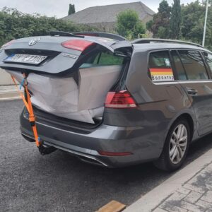loaded velomobile mold in a car trunk
