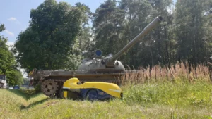 A velomobile and a tank